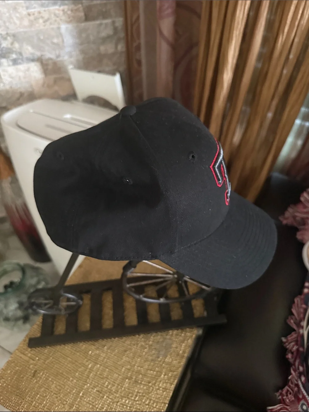 Black Baseball Cap with Embroidered 'T' Logo